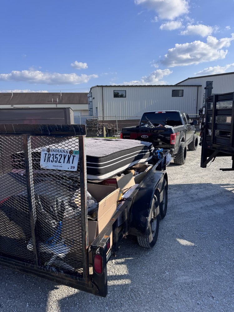 Property maintenance Carmel, IN — A1 Home Services Junk removal and hauling truck for property maintenance Carmel, IN by A1 Home Services